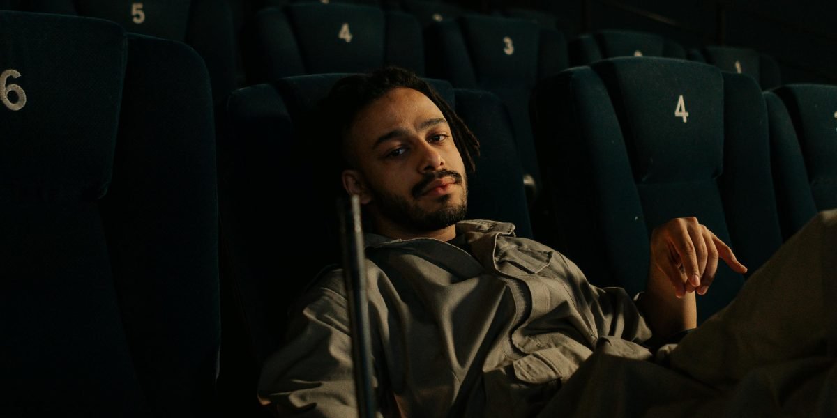 A person confidently picks a movie, having overcome decision fatigue with smart strategies.